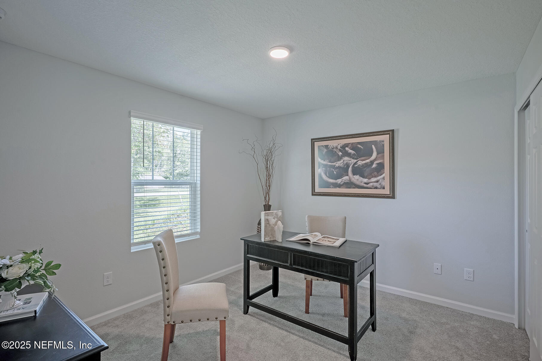 8768 Orme Road Jacksonville, FL 32220 - Photo 16 of 36 a view of a workspace with furniture and a window