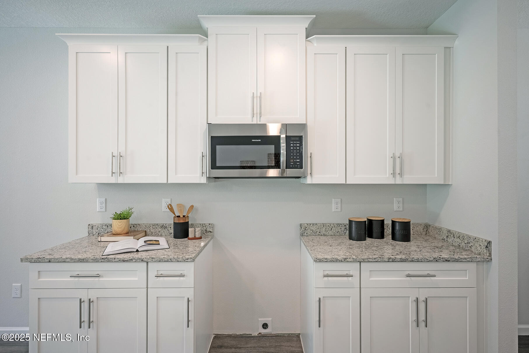 8768 Orme Road Jacksonville, FL 32220 - Photo 21 of 36 a kitchen with stainless steel appliances granite countertop a sink a stove and dishwasher with white cabinets