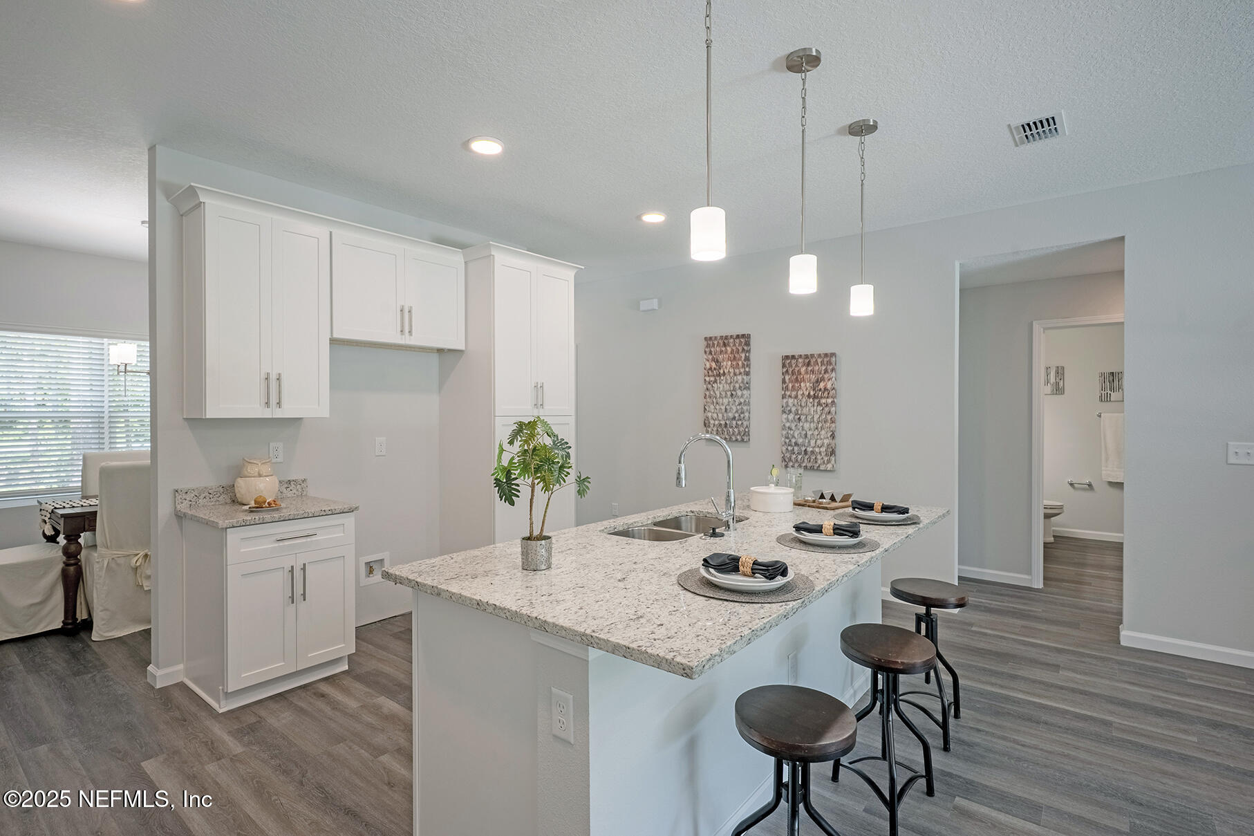 8768 Orme Road Jacksonville, FL 32220 - Photo 3 of 36 a kitchen with sink and refrigerator