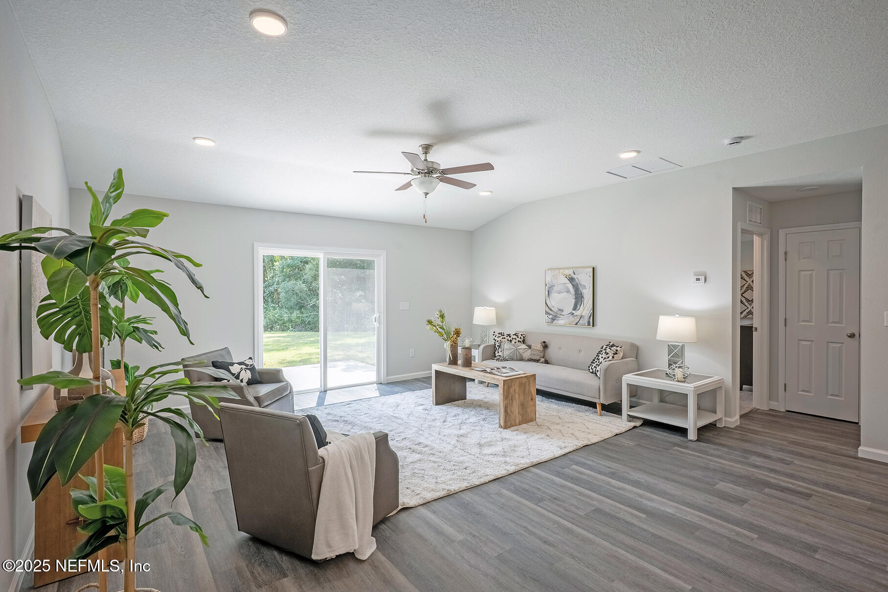 8768 Orme Road Jacksonville, FL 32220 - Photo 33 of 36 a living room with furniture and a large window