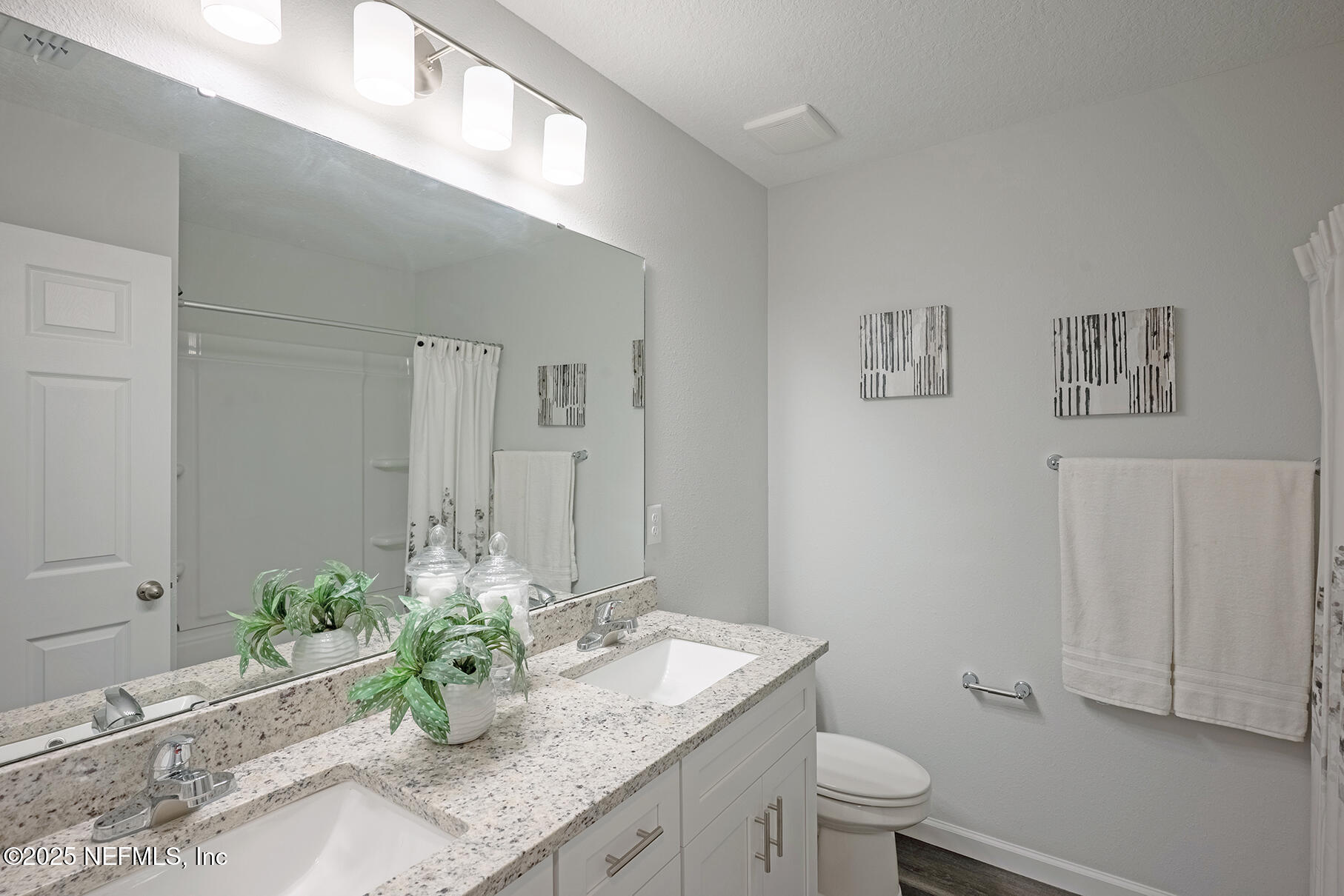8768 Orme Road Jacksonville, FL 32220 - Photo 8 of 36 a bathroom with a granite countertop sink a toilet and with mirror