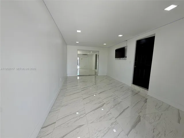 a room with furniture and a window