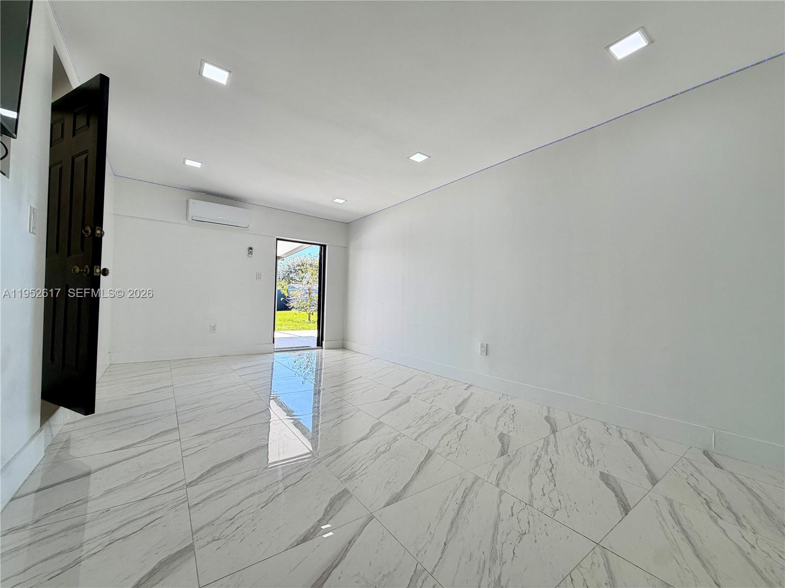 16320 Southwest 278th Street Homestead, FL 33031 - Photo 20 of 69 a view of empty room with wooden floor