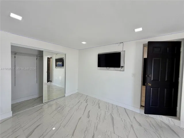 a view of an empty room and window