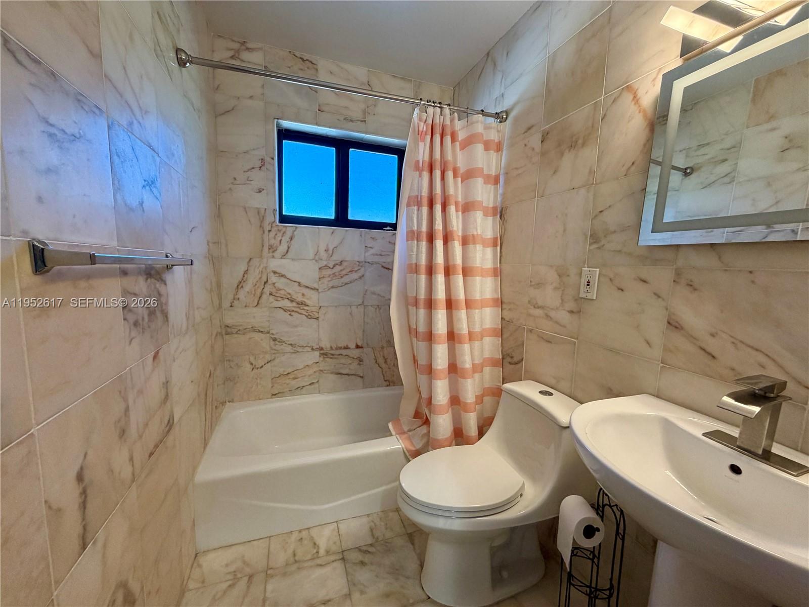 16320 Southwest 278th Street Homestead, FL 33031 - Photo 23 of 69 a bathroom with a sink toilet and shower