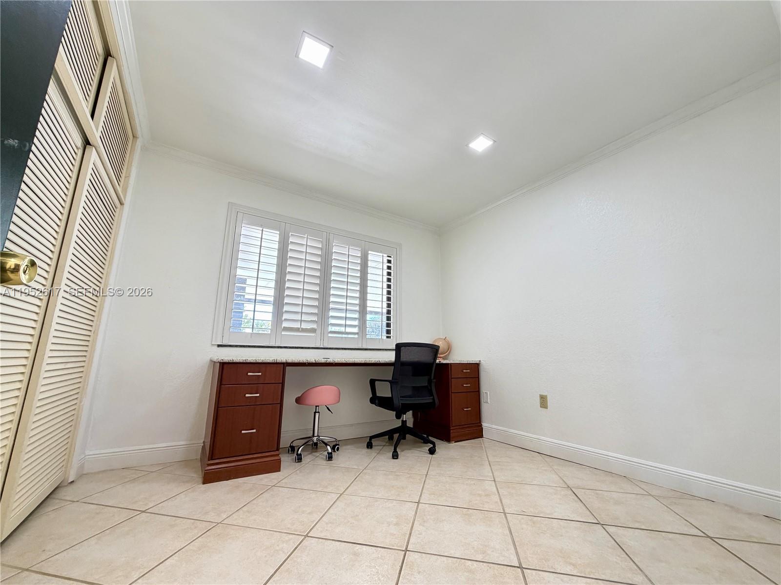 16320 Southwest 278th Street Homestead, FL 33031 - Photo 24 of 69 a room with furniture and a window