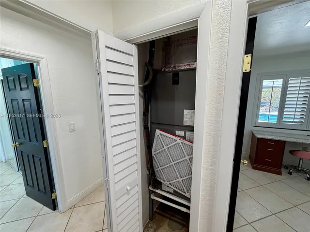 a view of an empty room and window