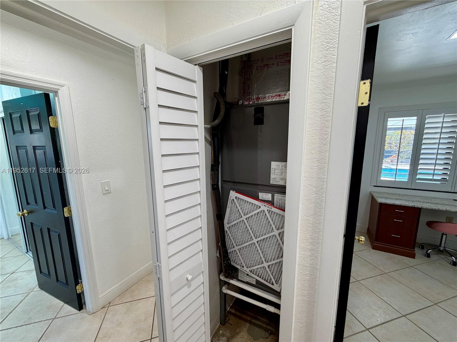 16320 Southwest 278th Street Homestead, FL 33031 - Photo 26 of 69 a view of a hallway to a livingroom with furniture