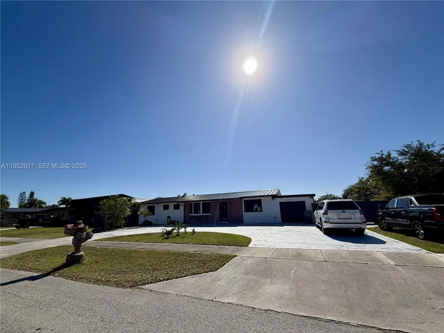 a backyard of a house with wooden fence