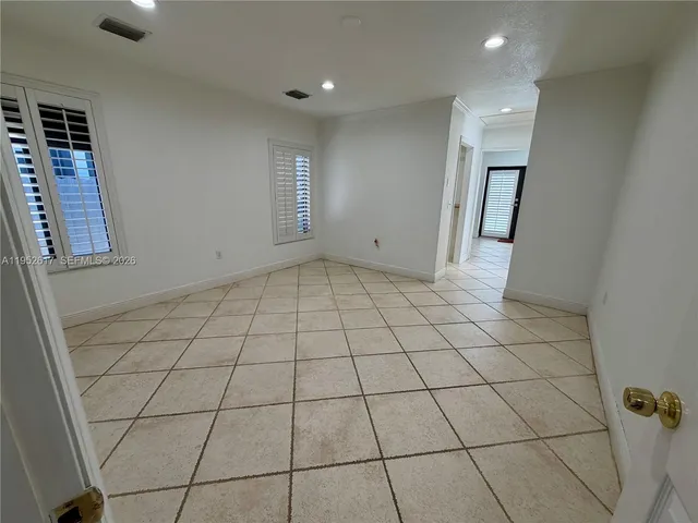 a bathroom with a double vanity sink a toilet and mirror