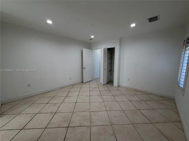 a bathroom with a shower and toilet