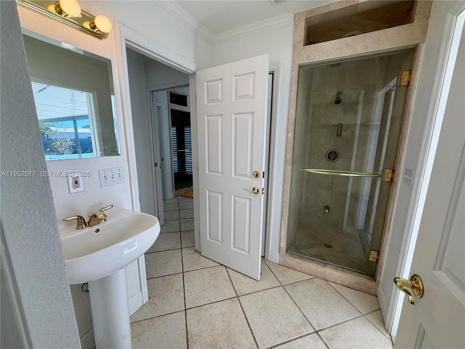 16320 Southwest 278th Street Homestead, FL 33031 - Photo 36 of 69 a bathroom with a sink and a mirror