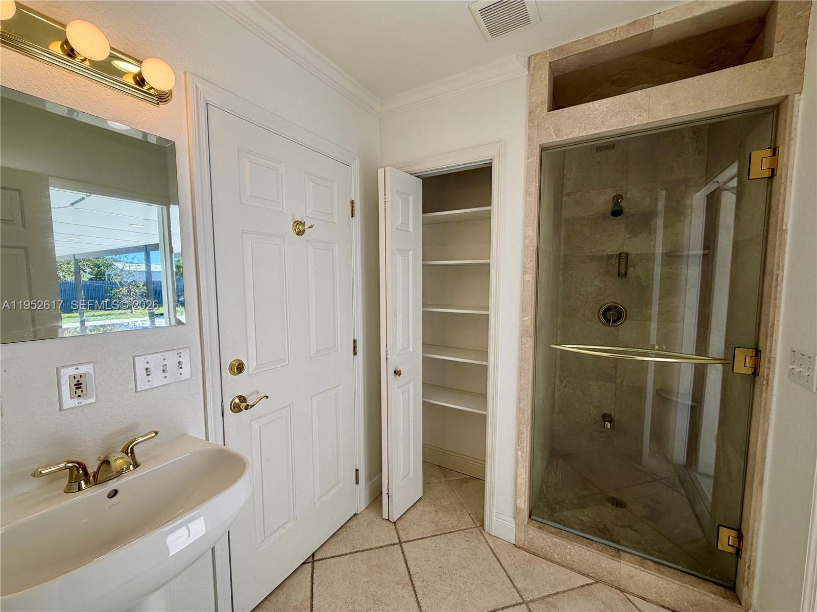 16320 Southwest 278th Street Homestead, FL 33031 - Photo 37 of 69 a bathroom with a shower and a sink