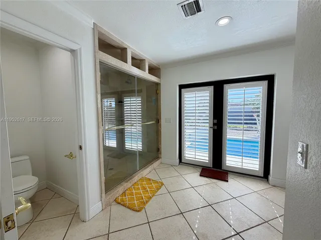 a view of living room with furniture and a flat screen tv