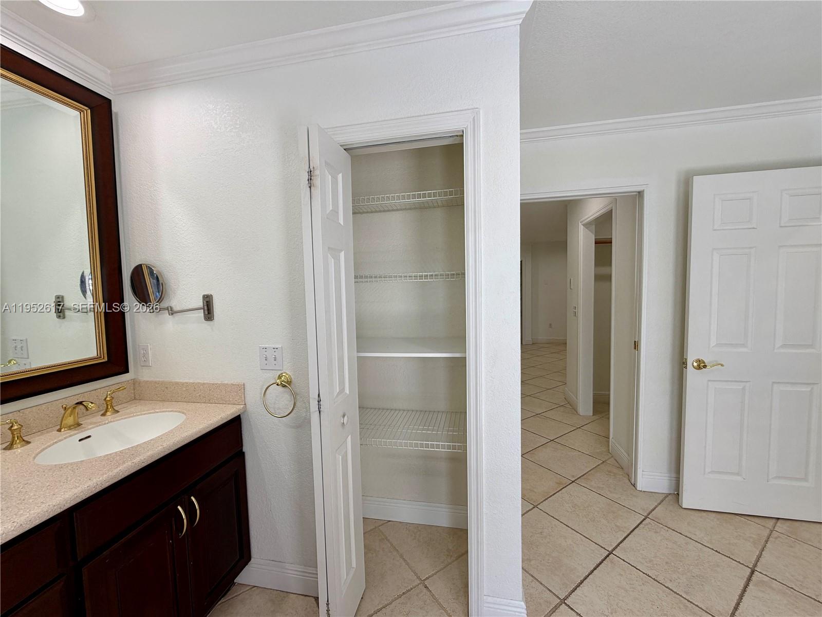 16320 Southwest 278th Street Homestead, FL 33031 - Photo 41 of 69 a bathroom with a double vanity sink a toilet and mirror