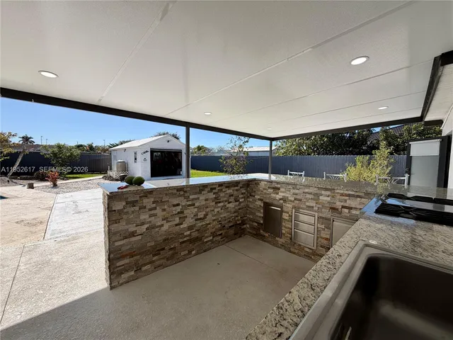 a view of kitchen and living room