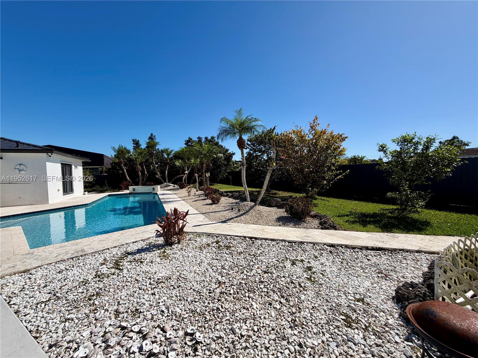 16320 Southwest 278th Street Homestead, FL 33031 - Photo 61 of 69 a backyard of a house with lots of green space