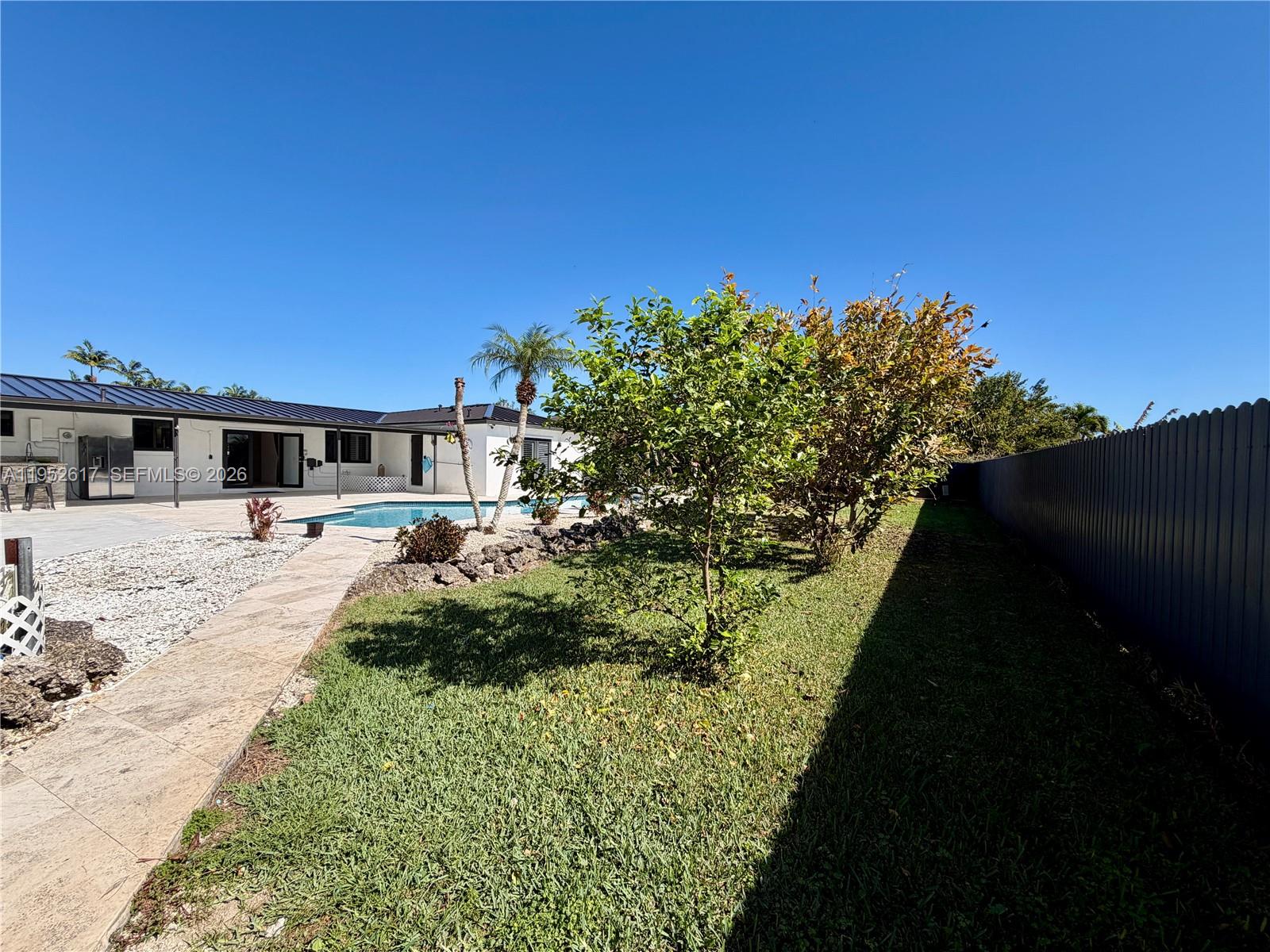 16320 Southwest 278th Street Homestead, FL 33031 - Photo 62 of 69 a front view of a house with a garden
