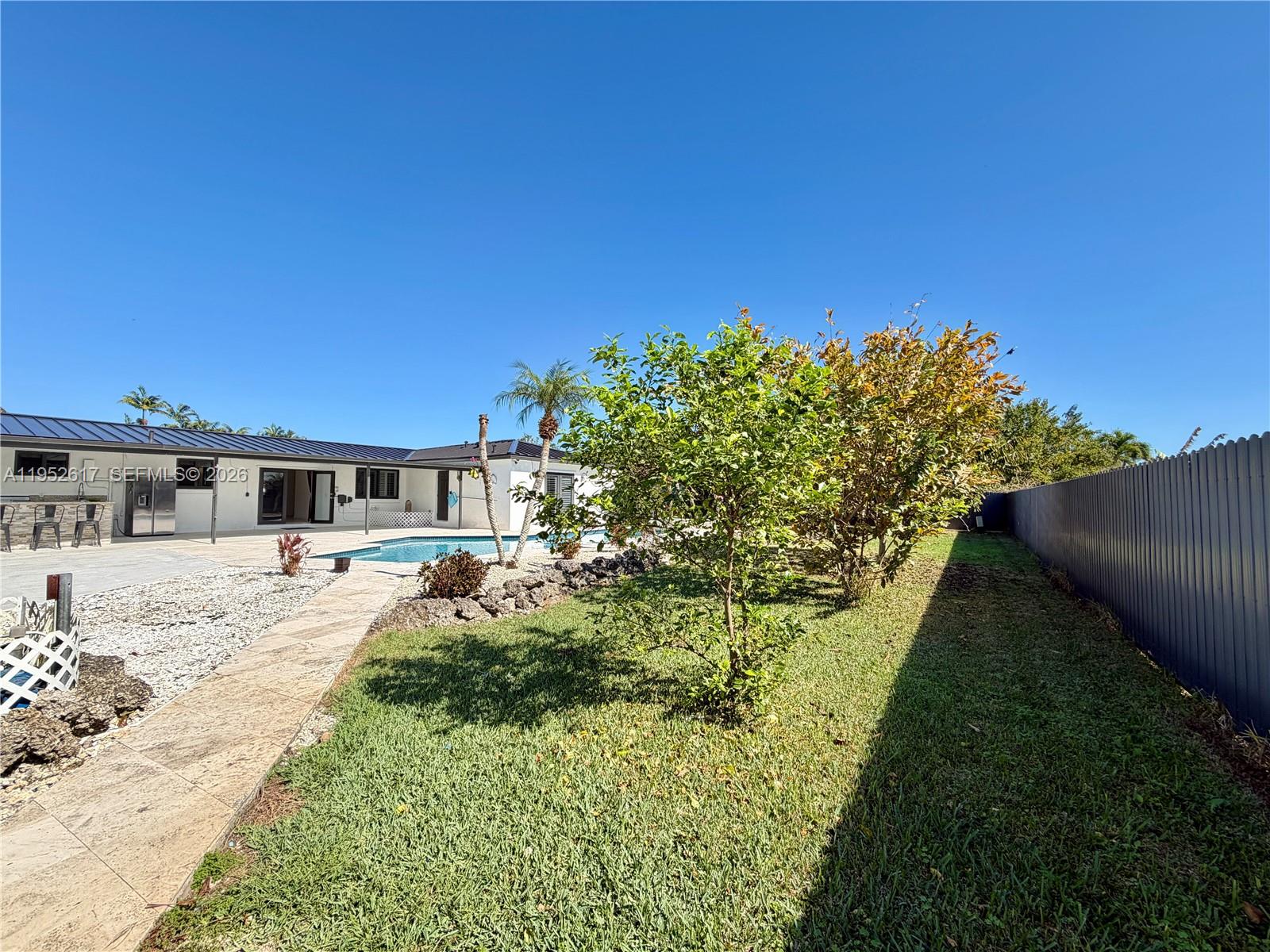 16320 Southwest 278th Street Homestead, FL 33031 - Photo 63 of 69 a front view of a house with a yard