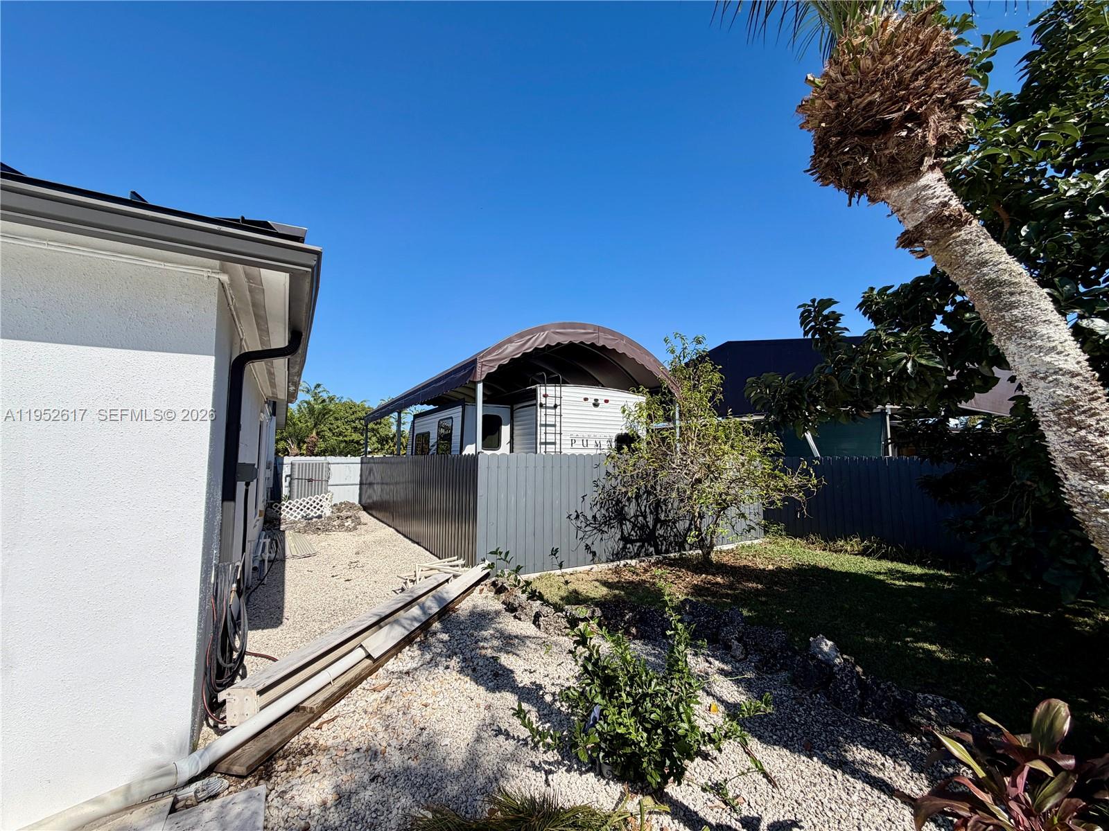 16320 Southwest 278th Street Homestead, FL 33031 - Photo 68 of 69 a front view of a house with a yard