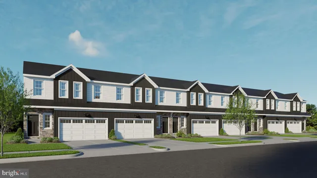 a view of houses with a street