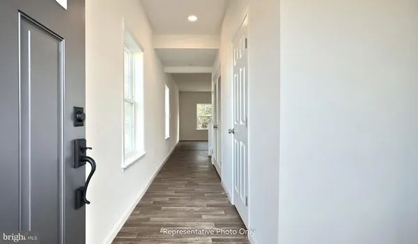 a view of a hallway with a wooden door