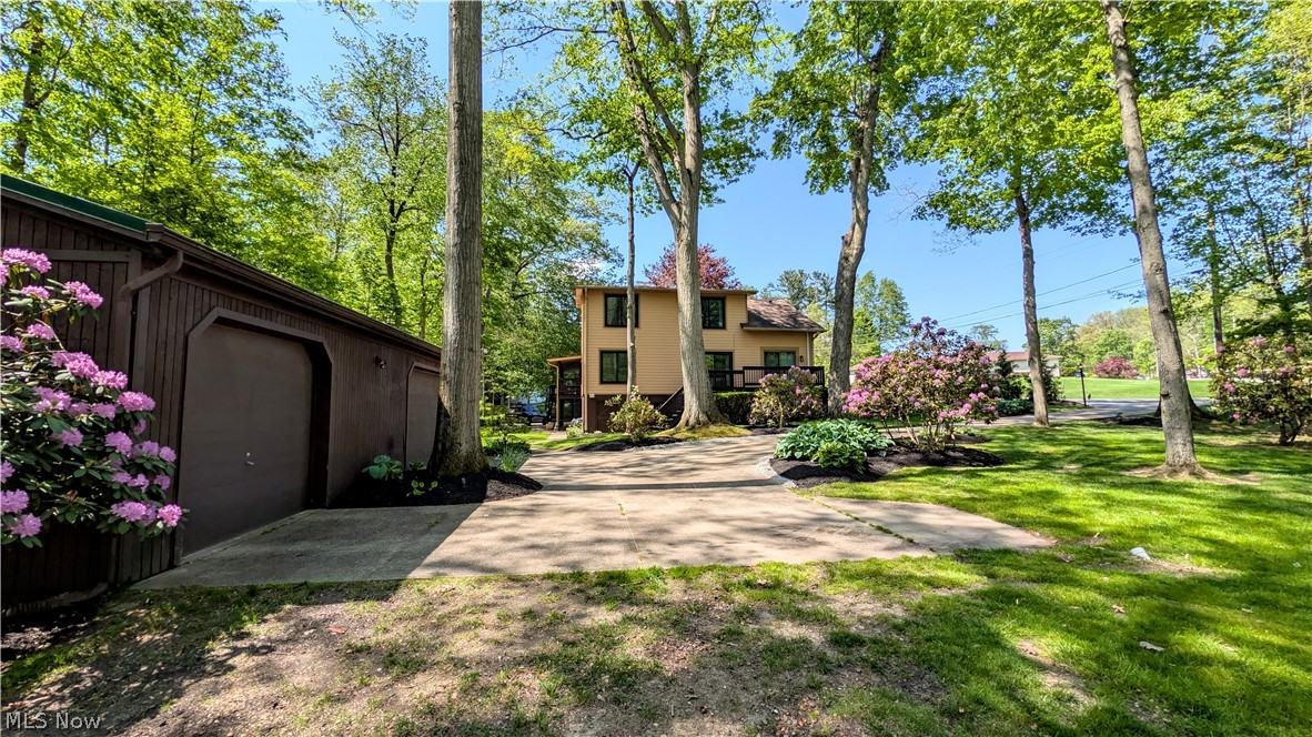 6409 Old Woods Road Ashtabula, OH 44004 - Photo 35 of 43 Expansive green lawn with mature trees and established landscaping
