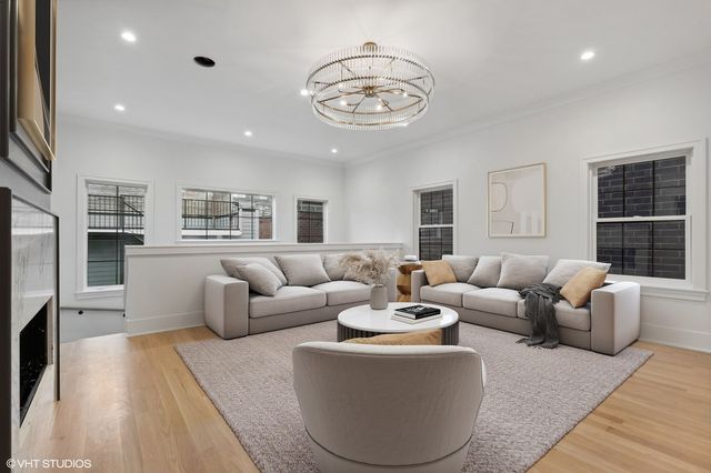 a view of a livingroom with an empty space and a window