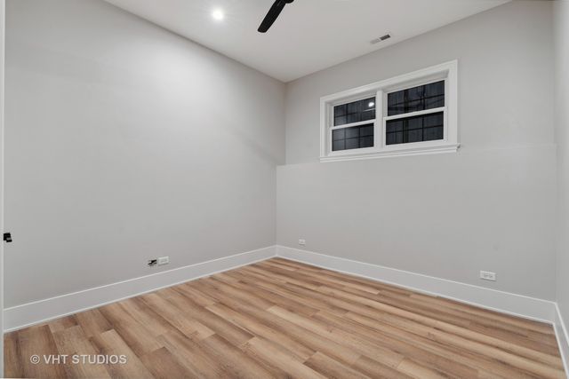 a bathroom with a sink vanity tub and a mirror
