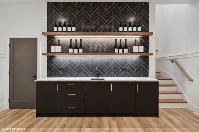 a bathroom with a sink vanity and a mirror