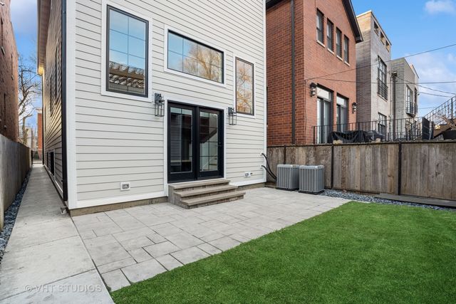a balcony with furniture and wooden floor