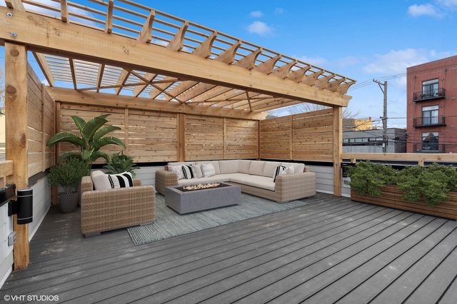 a view of a patio with wooden floor