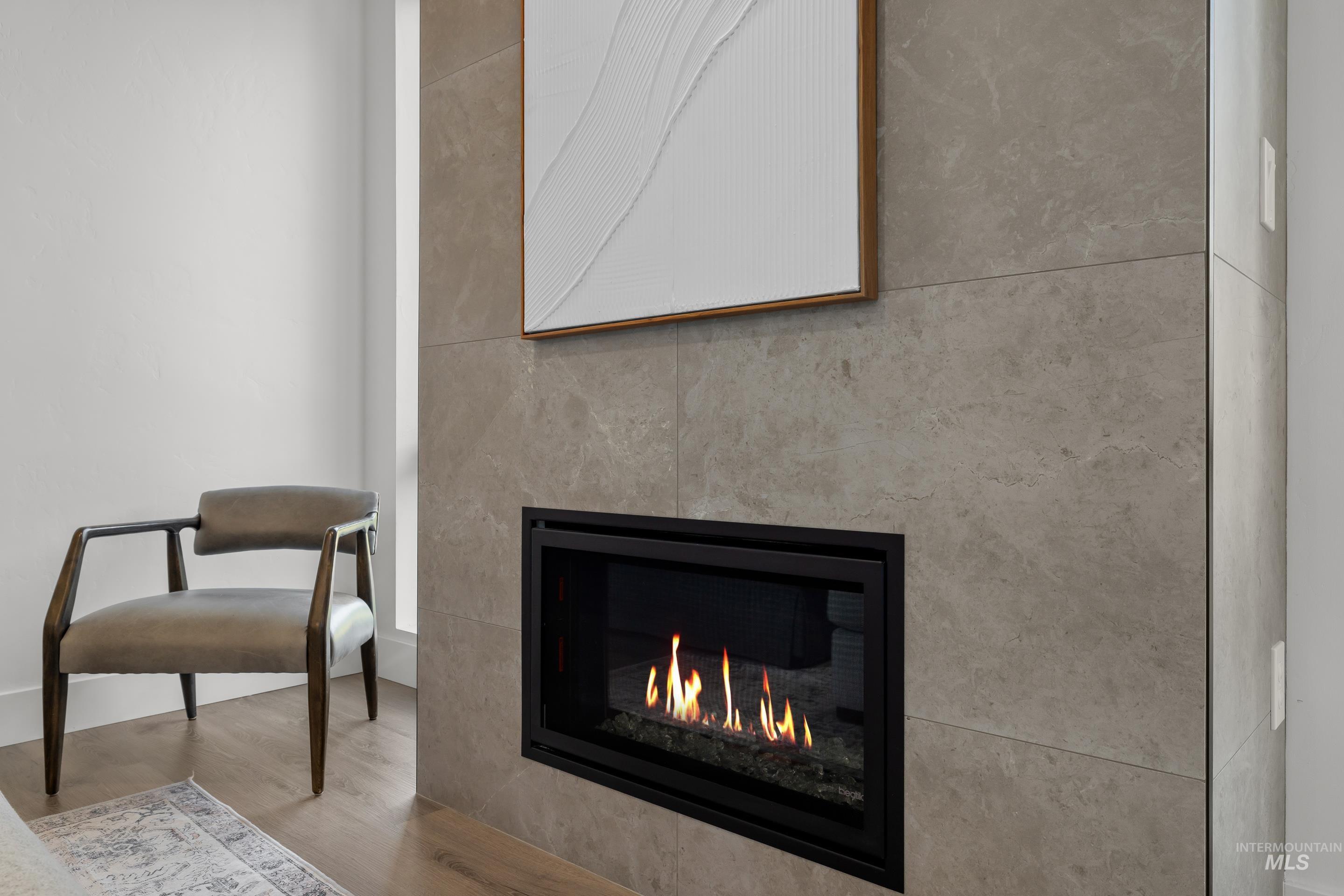 1620 West Bannock Street, Unit 403 Boise, ID 83702 - Photo 11 of 38 Detailed view of wood finished floors and a glass covered fireplace