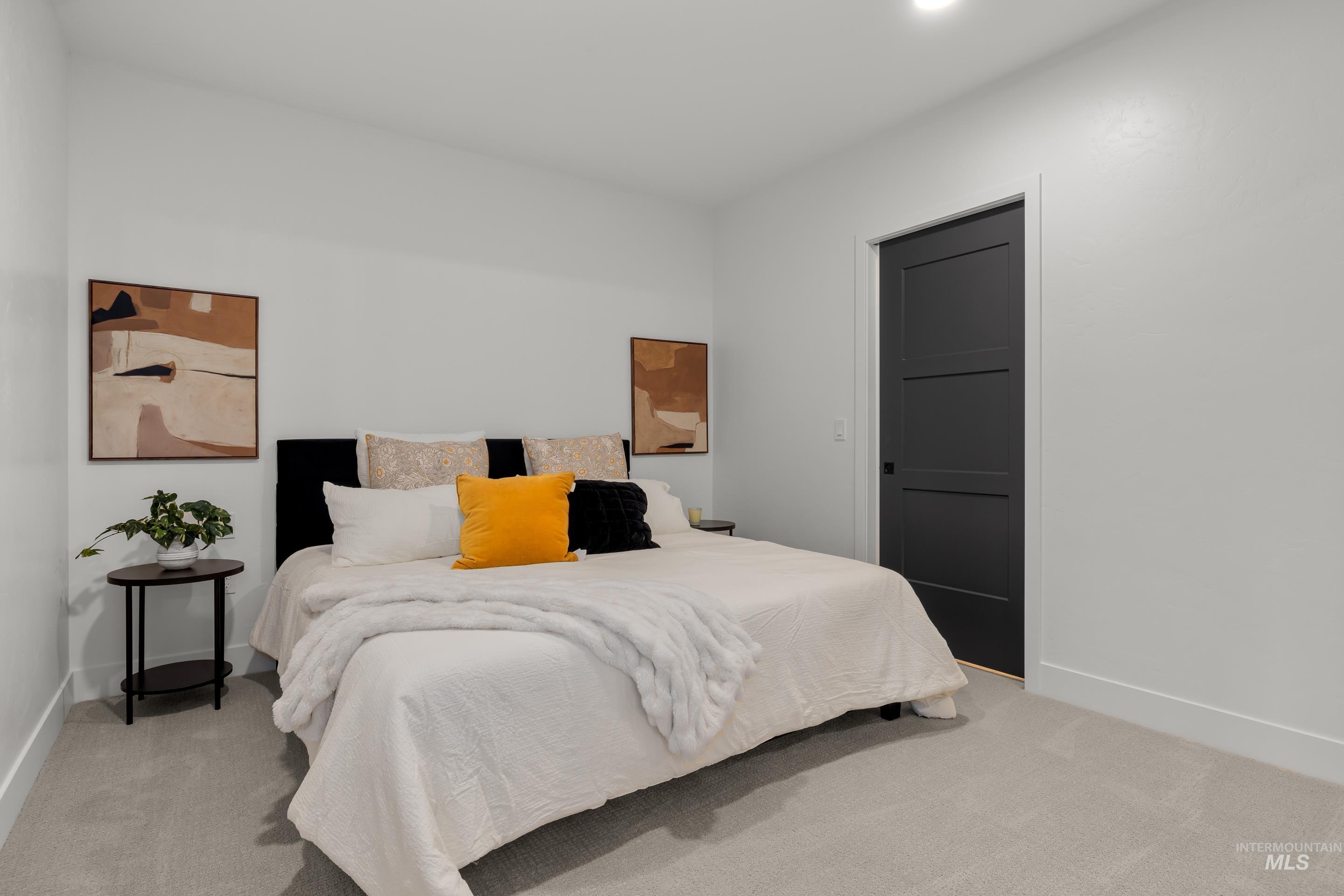 1620 West Bannock Street, Unit 403 Boise, ID 83702 - Photo 14 of 38 Bedroom with light carpet and baseboards