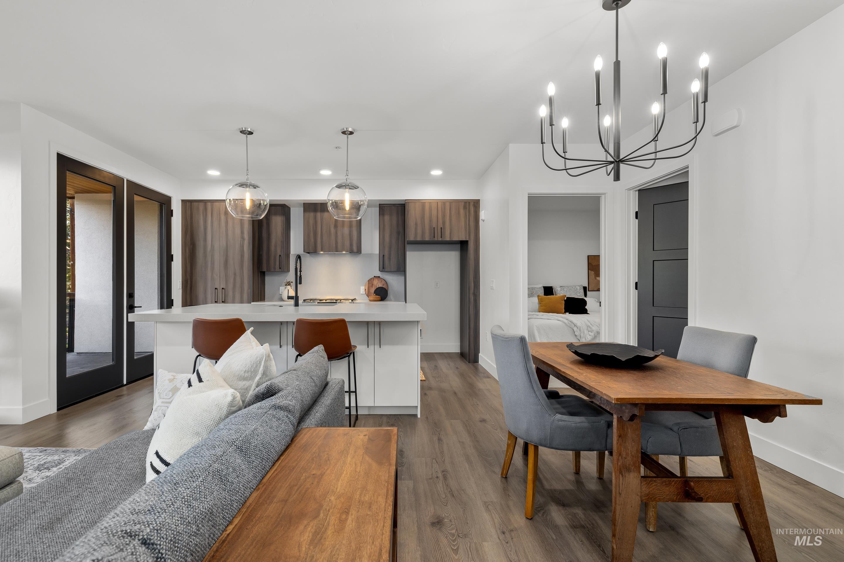 1620 West Bannock Street, Unit 403 Boise, ID 83702 - Photo 5 of 38 Dining room featuring dark wood-style floors, a chandelier, and recessed lighting