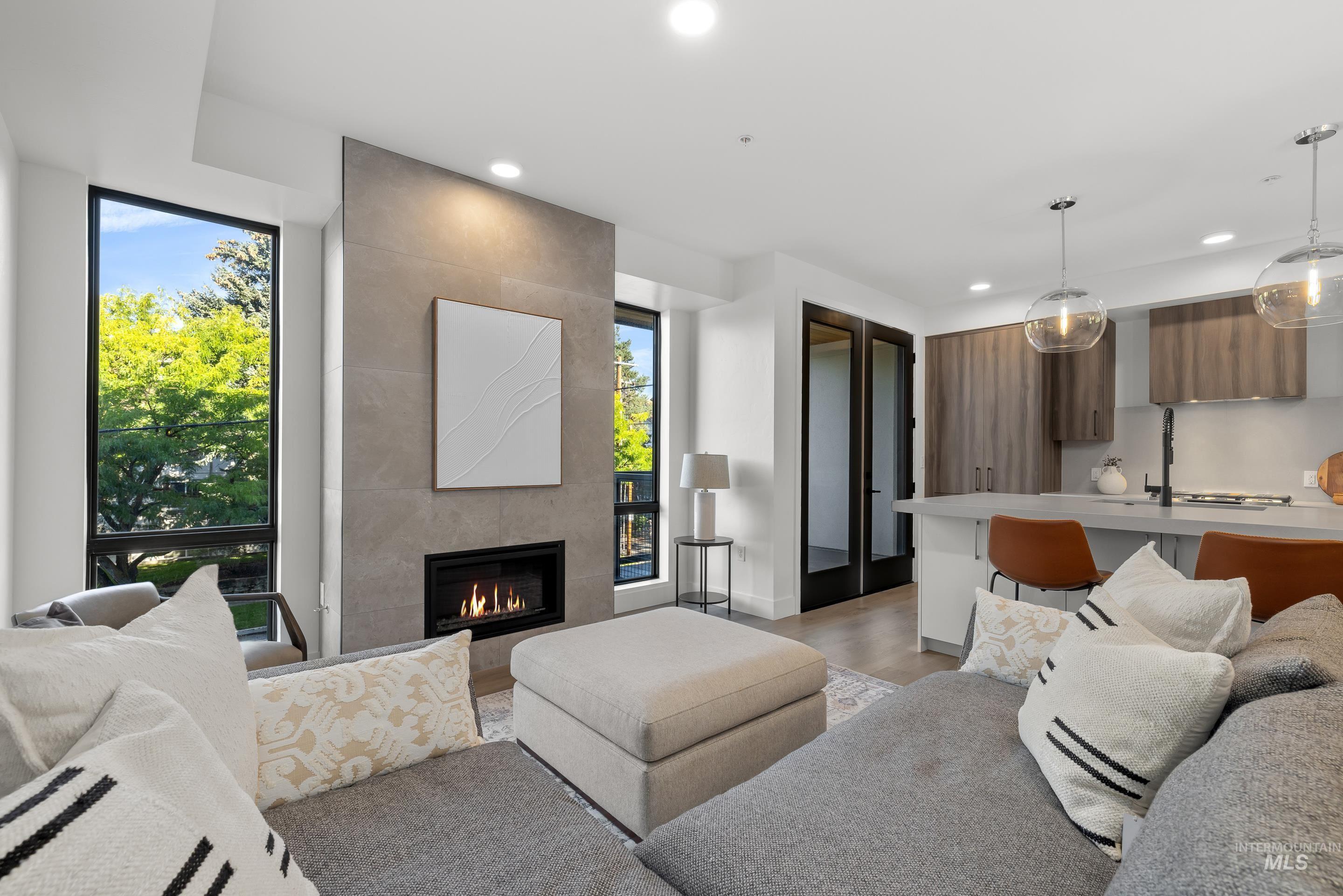 1620 West Bannock Street, Unit 403 Boise, ID 83702 - Photo 8 of 38 Living area with light wood-style floors, recessed lighting, and a tile fireplace