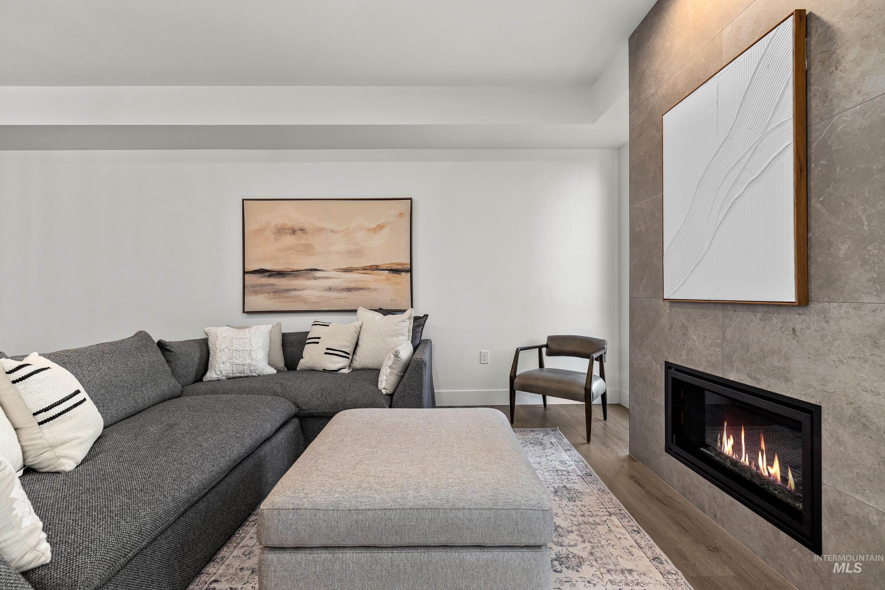 1620 West Bannock Street, Unit 403 Boise, ID 83702 - Photo 10 of 38 Living room with wood finished floors and a fireplace