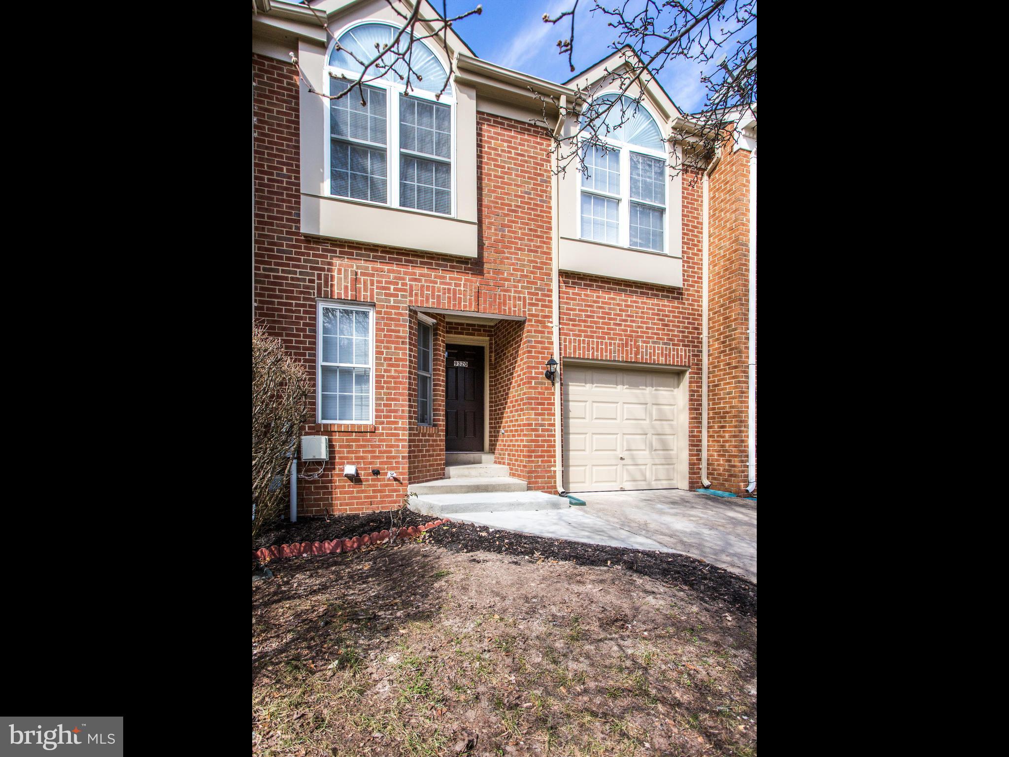 9320 Ispahan Loop Laurel, MD 20708 - Photo 1 of 30 a front view of a house with a yard