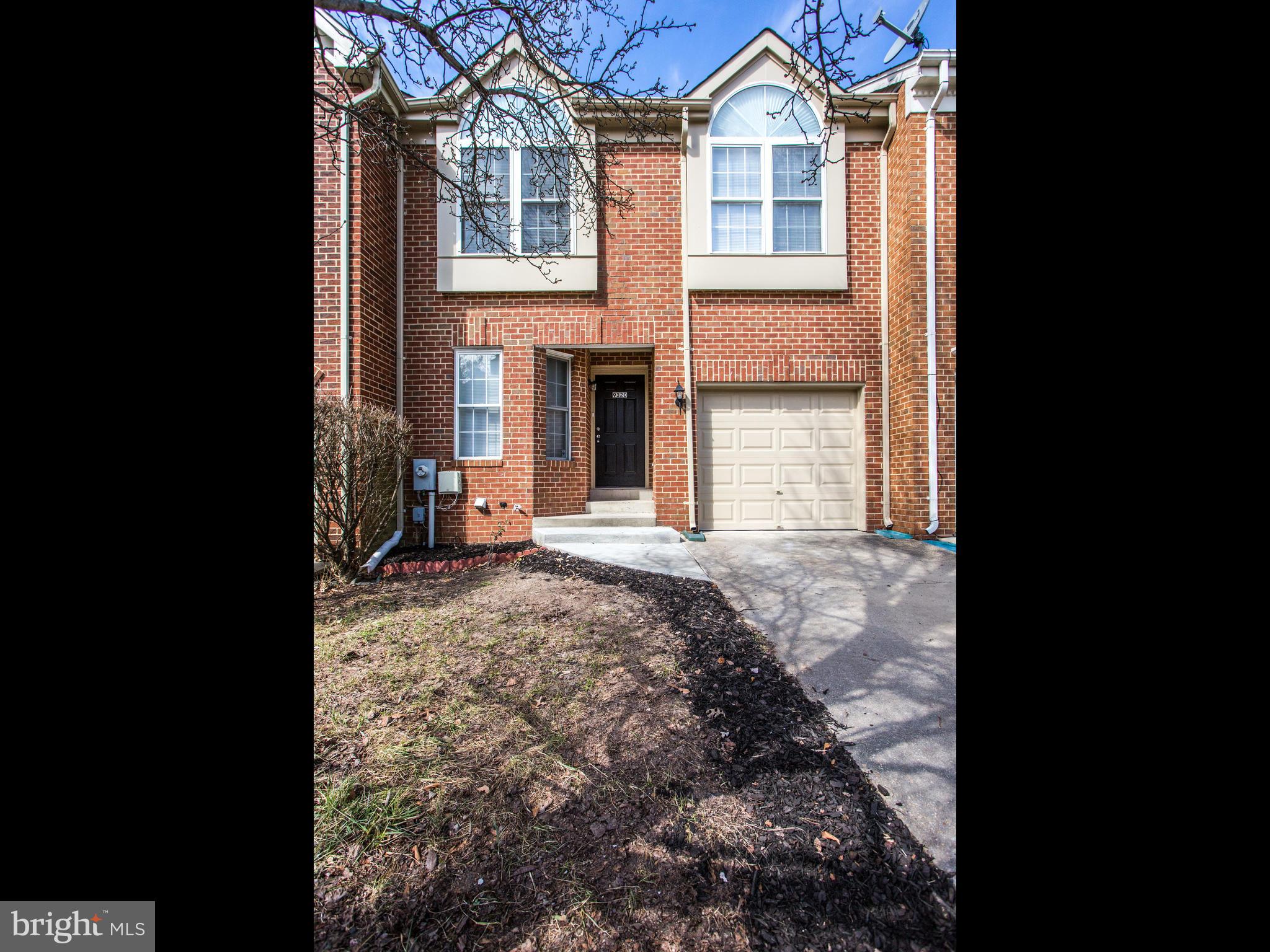 9320 Ispahan Loop Laurel, MD 20708 - Photo 2 of 30 a front view of a house with a yard