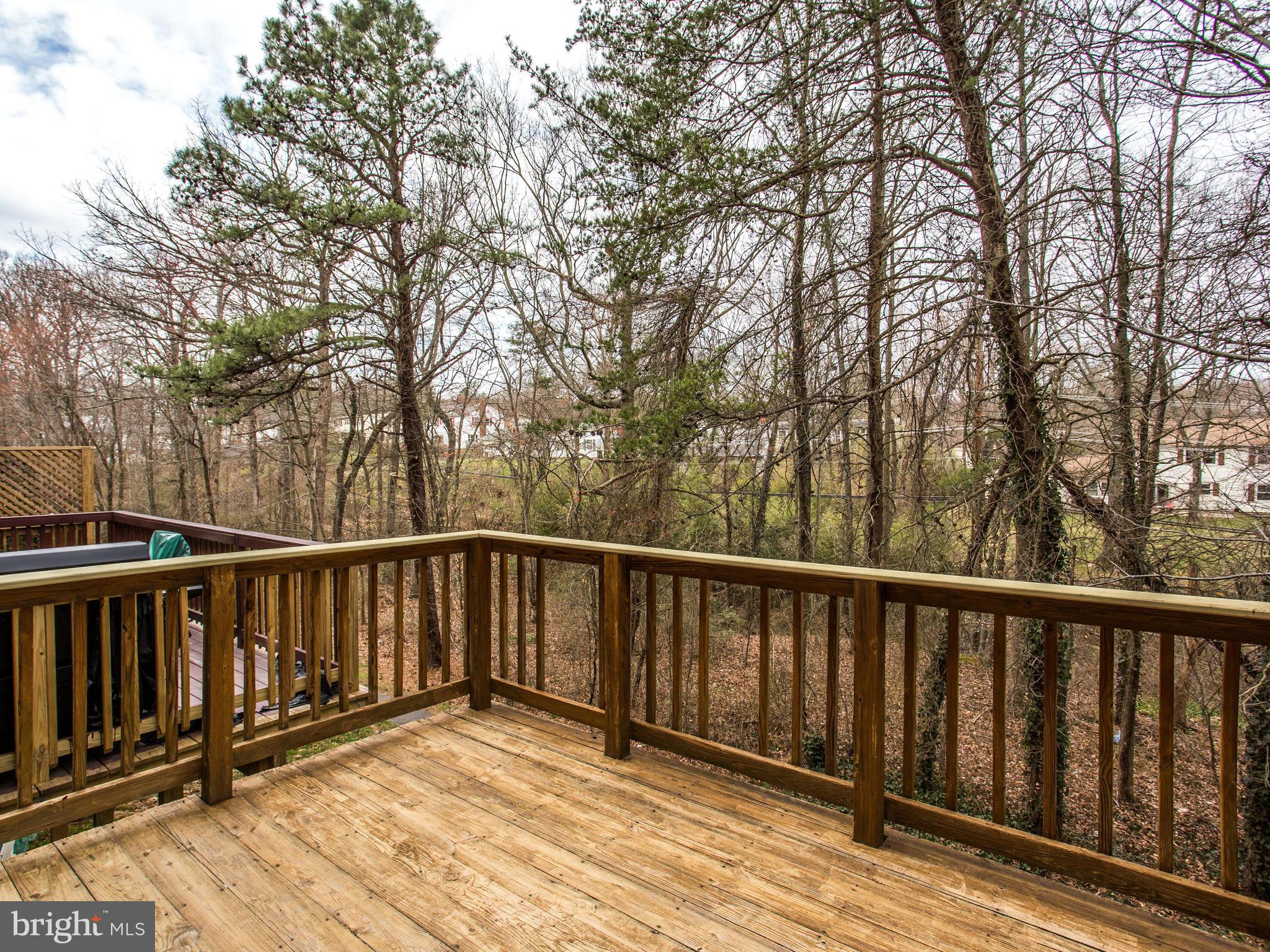 9320 Ispahan Loop Laurel, MD 20708 - Photo 17 of 30 a balcony with wooden floor and fence