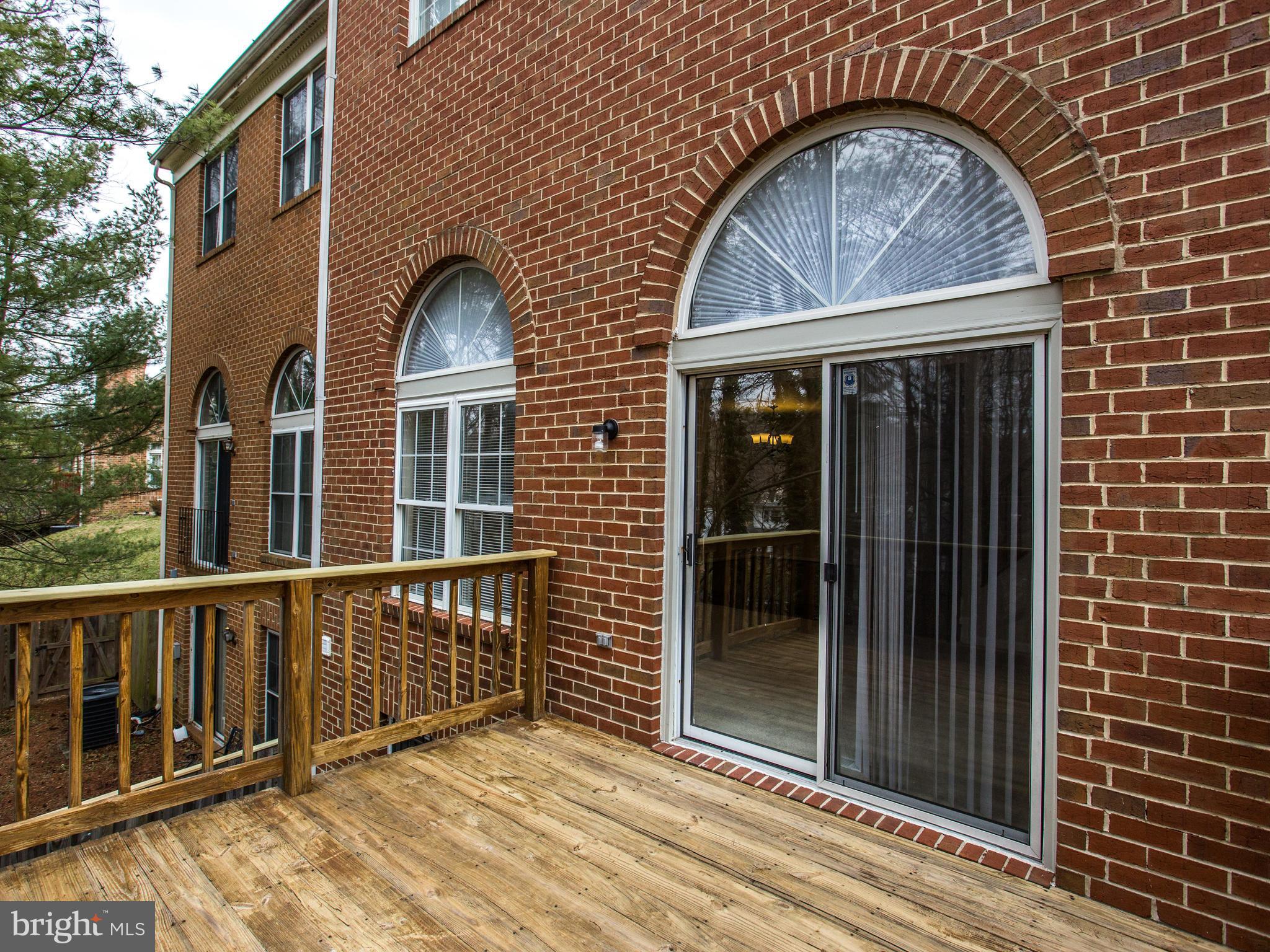 9320 Ispahan Loop Laurel, MD 20708 - Photo 18 of 30 a view of wooden house with a large window