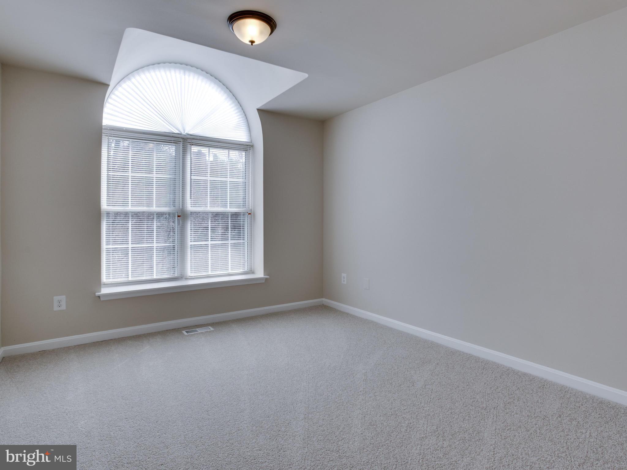 9320 Ispahan Loop Laurel, MD 20708 - Photo 20 of 30 an empty room with a window