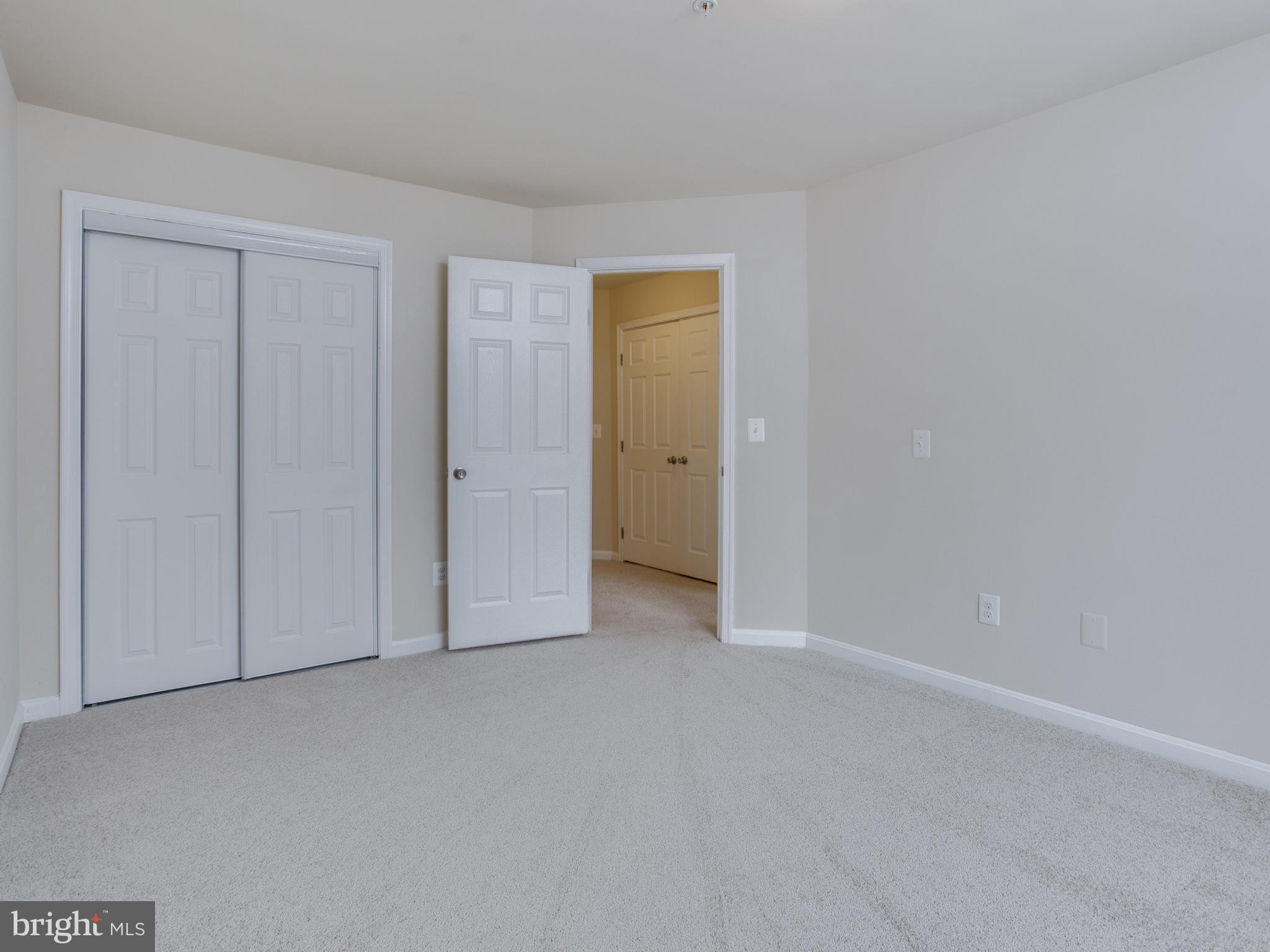 9320 Ispahan Loop Laurel, MD 20708 - Photo 21 of 30 a view of an empty room and closet area