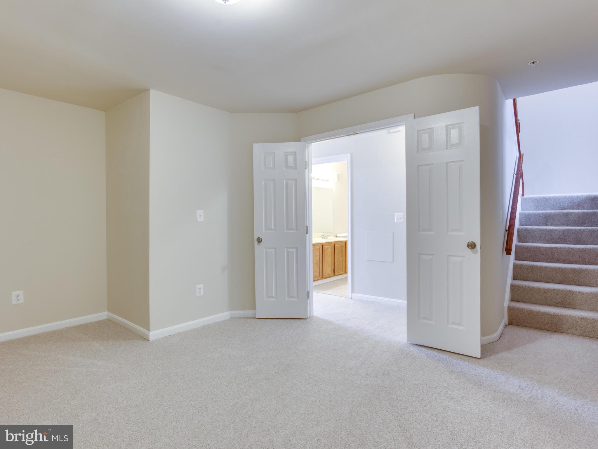 9320 Ispahan Loop Laurel, MD 20708 - Photo 23 of 30 a view of an empty room with a window
