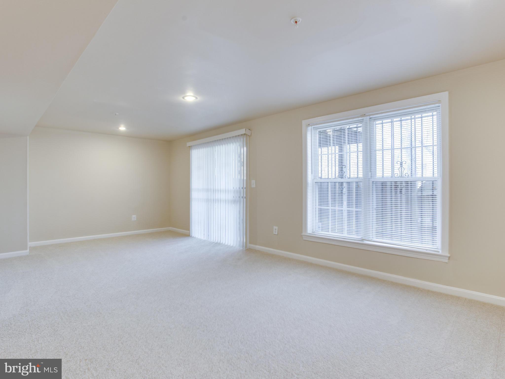 9320 Ispahan Loop Laurel, MD 20708 - Photo 26 of 30 an empty room with windows