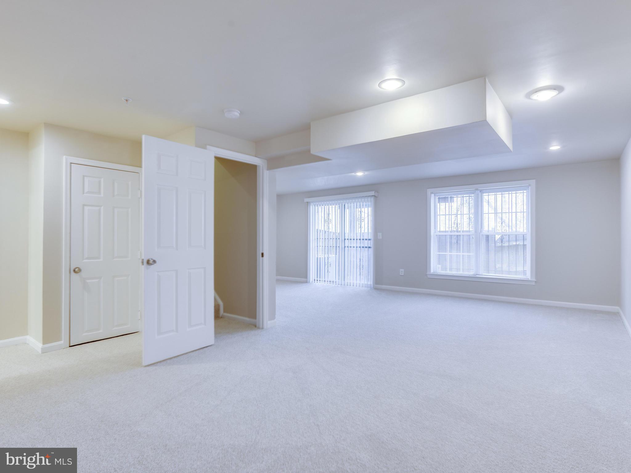 9320 Ispahan Loop Laurel, MD 20708 - Photo 29 of 30 a view of an empty room with a window