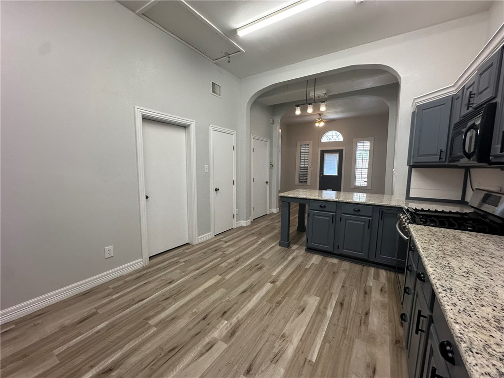 221 Commerce Street, Unit E Portland, TX 78374 - Photo 11 of 26 a bathroom with a sink and a mirror