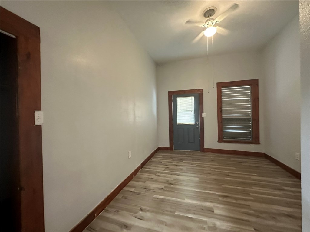 221 Commerce Street, Unit E Portland, TX 78374 - Photo 12 of 26 a view of an empty room with closet and a window