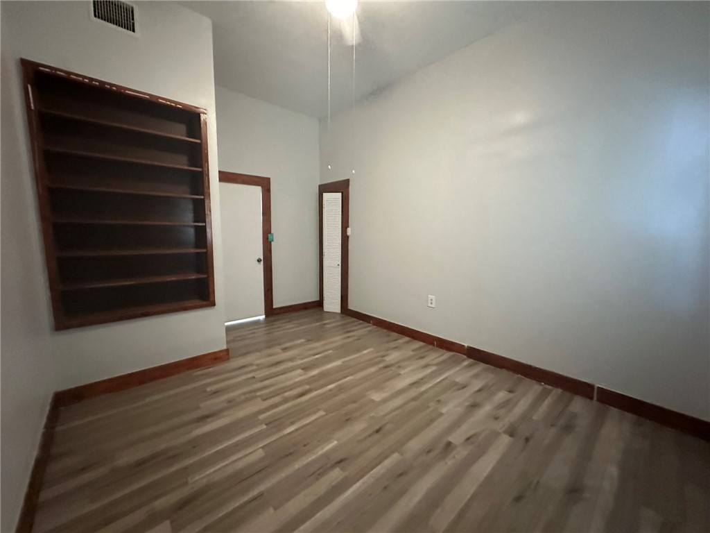 221 Commerce Street, Unit E Portland, TX 78374 - Photo 14 of 26 a view of an empty room with a window