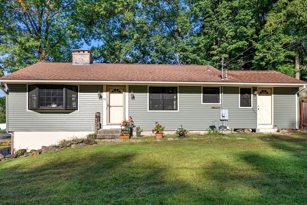73 Northridge Road Westfield, MA 01085 - Photo 1 of 21 a front view of a house with a garden